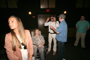 Executive Producer David Alfonso tries out the Sony Closed Captioning Glasses with Jenni & producer Jeff Maynard.